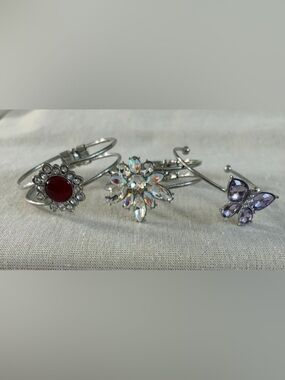 Three silver tone bracelets.  Stylish and Glamorous